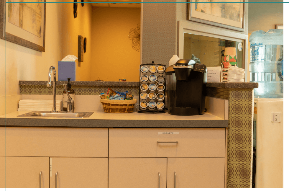 Coffee machine and sink in reception area