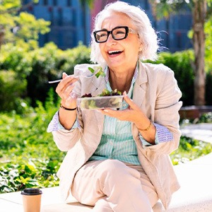 Lady eats salad