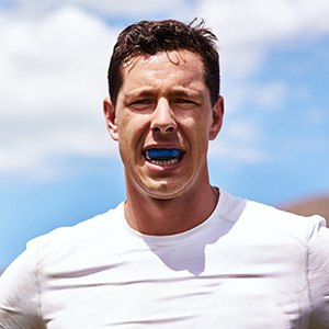 Man wears mouthguard