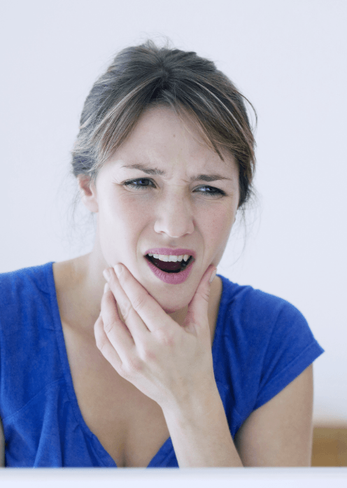 Woman holding her jaw in pain needing T M J treatment in Boise