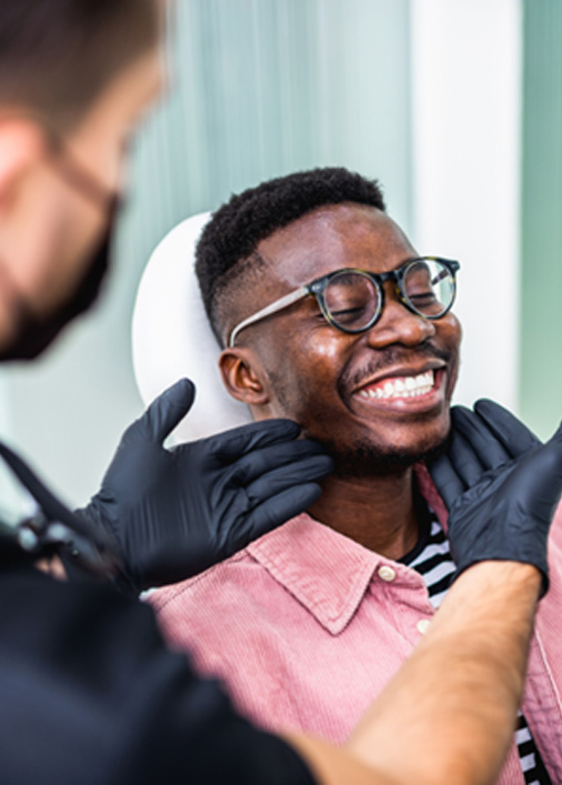 Man smiling at the dentist