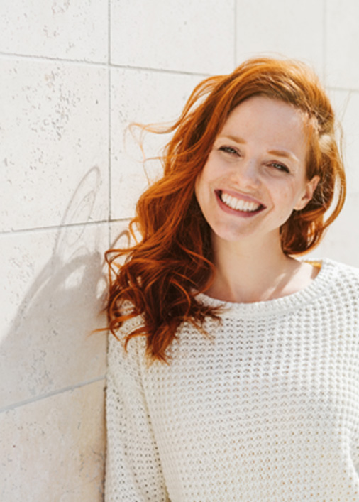 Woman smiling outside